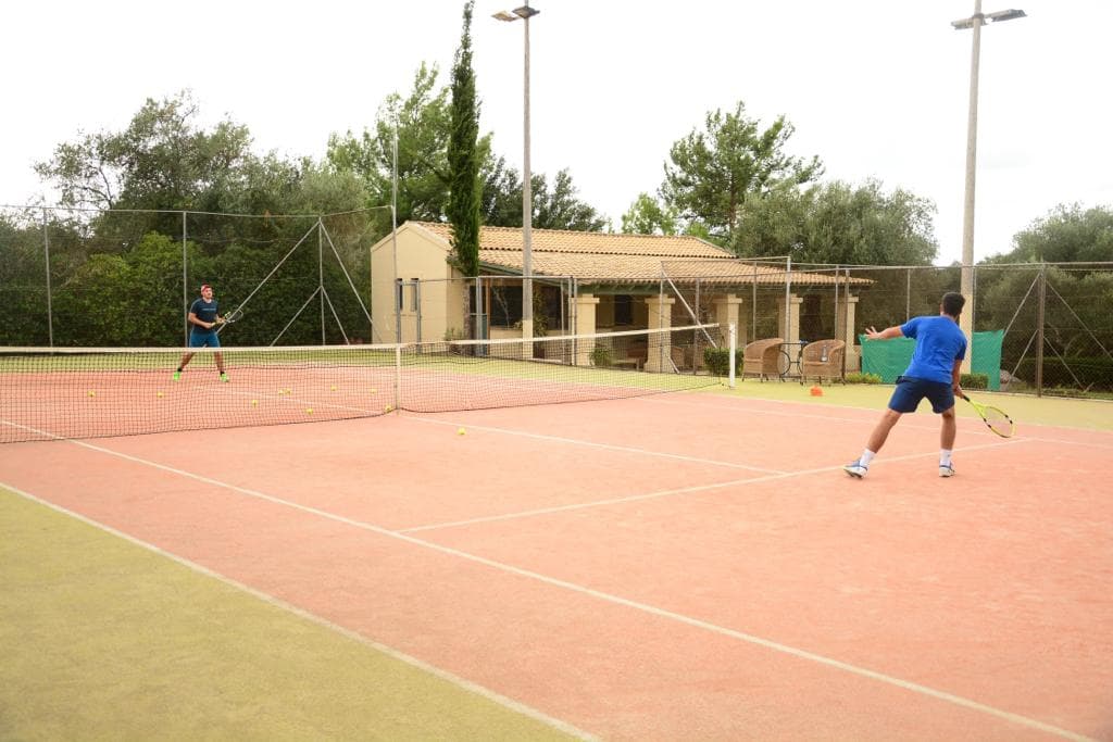 Two players rallying on a clay court
